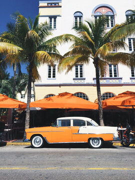 Naklejki Classic Car outside Art Deco Hotel in South Beach, Miami