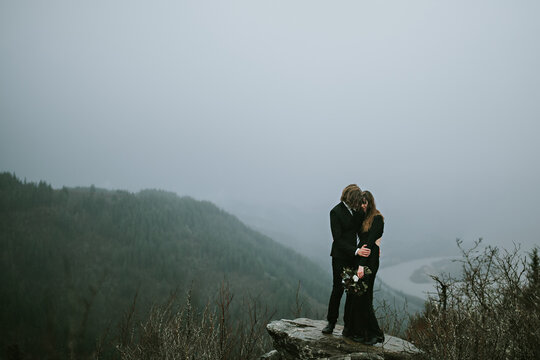 Bride and Groom Eloping on a Mountain
