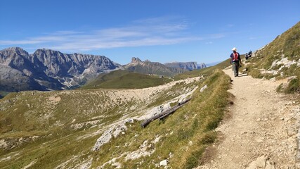 Val Gardena, Italy - 09/15/2020: Scenic alpine place with magical Dolomites mountains in background, amazing clouds and blue sky in Trentino Alto Adige region, Italy, Europe