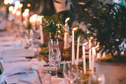 Table decorated with candles; Candles centerpiece for a a fancy dinner party