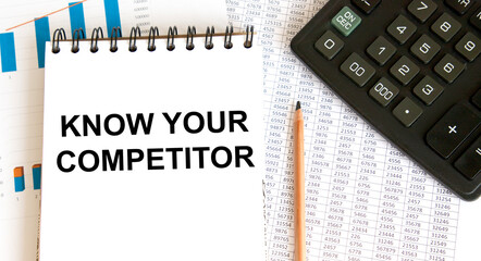On a sheet of diary the inscription KNOW YOUR COMPETITOR, next to a pencil pointing to it, and...