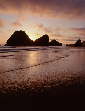 35-mmfilm image cape sebastian Oregon sunset clouds seastacks silhouettes incoming tide, reflections