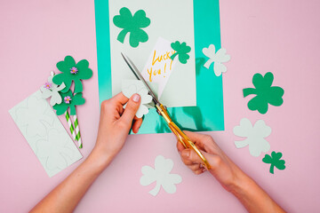 Woman Making Paper Shamrock as a Decoration for Saint Patrick's Day