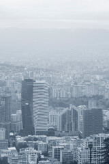 Fototapeta na wymiar Monochrome view of a capital city centre. Blue monochrome cityscape.