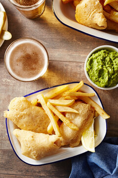 Junk food with beer and mushy peas