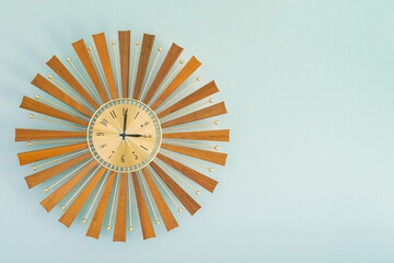 Close-up of a vintage sunburst clock.