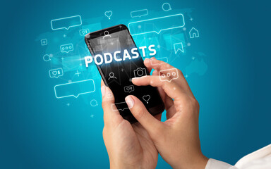 Female hand typing on smartphone with PODCASTS inscription, social media concept
