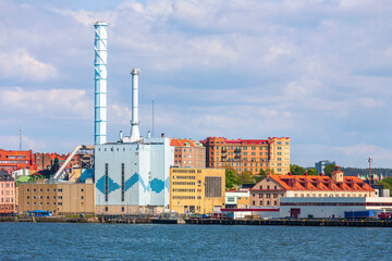 Fototapeta premium Cityscape view at Gothenburg with a heating plant at the waterfront