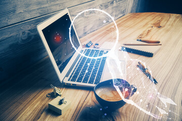 Desktop computer background in office and start up theme hologram drawing. Double exposure. Startup concept.