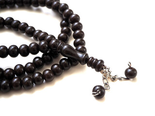 99 Islamic prayer beads on a white background,