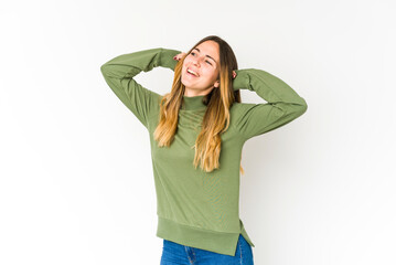 Young caucasian woman isolated on white background stretching arms, relaxed position.