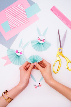 Woman Making Easter Bunny Rosettes As an Easter Decoration
