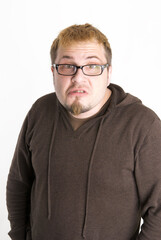 Obraz premium Perplexed Man with Glasses and Brown Sweatshirt