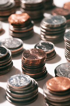Coins: Focus On Penny On Top Of Coin Stack