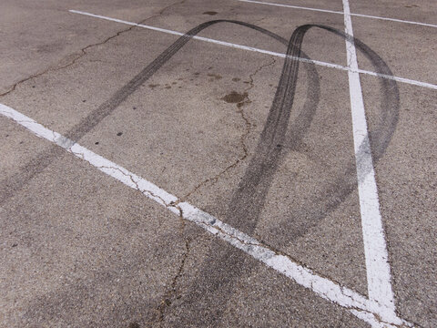 Skid Marks from Tires Peeling Out in Parking Lot