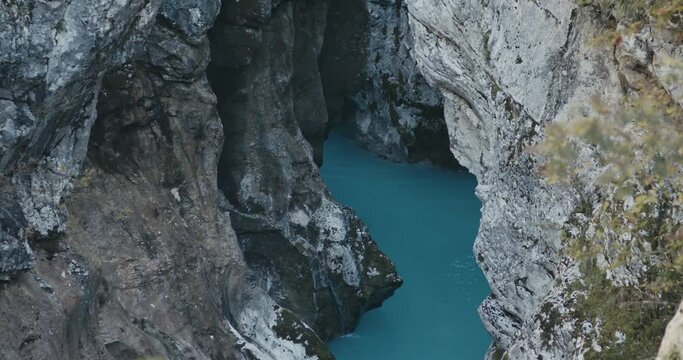 Wild river riverbed beautiful stream of pure clear water flow in gorge or canyon rocks Soča in the  protected mountains of Alps