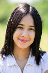 Fototapeta premium Positive young brazilian female portrait in summer garden. High quality photo