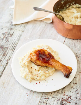 Tasty roasted chicken leg with mashed potato