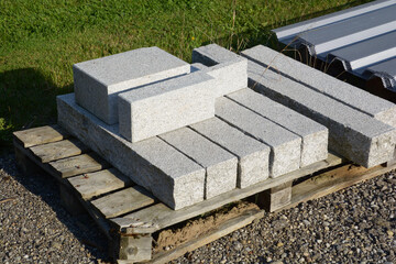 old granite road construction material on wooden pallet