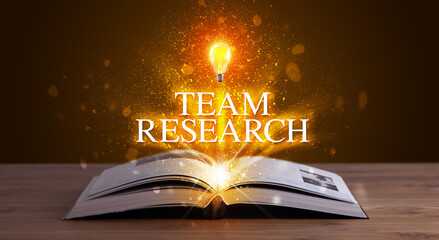 TEAM RESEARCH inscription coming out from an open book, educational concept