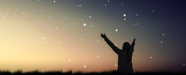 a silhouette of open arms girl at outdoor night.