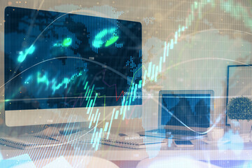 Stock market chart hologram drawn on personal computer background. Double exposure. Concept of investment.