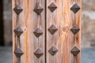 Wooden door with the thorns
