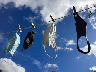 face masks on washing line reusable and washed masks  for protection from coronavirus covid-19...