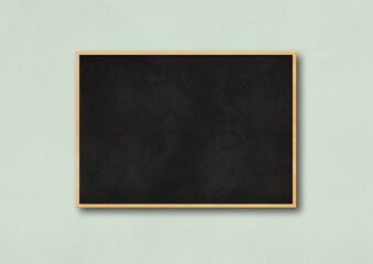 Traditional black board isolated on a light blue background
