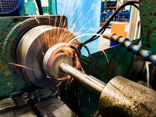 Grinding the hole with an abrasive stone on a circular grinding machine.