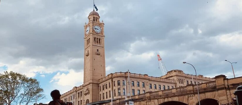 Time-lapse of fast dark moving Clouds over a clock tower in Sydney CBD Australia