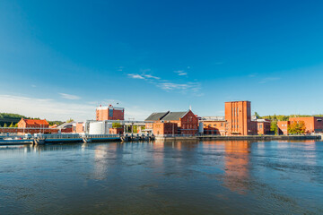 Naklejka premium Kouvola, Finland - 15 September 2020: Old red brick buildings of Upm factory in Kuusankoski.