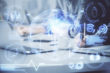 Science hologram with man working on computer on background. Concept of study. Double exposure.