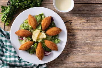 Traditional lebanese kibbeh on wooden table.Top view