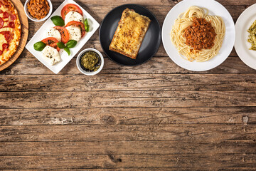 Assortment of Italian pasta dishes on wooden table.Top view. Copy space	