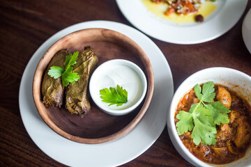 Food concept. Soup, chicken, salat on wooden table