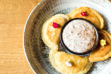 Restaurant food. Homemade tasty dessert with berry and sour cream