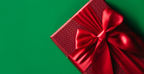 Banner of Red gift boxes on green background. Christmas card. Flat lay. Top view with space for text.