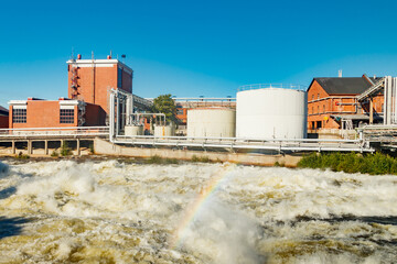 Kouvola, Finland - 15 September 2020: Old red brick buildings of Upm factory on rapids Kuusankoski...
