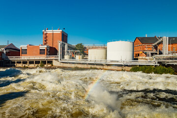 Kouvola, Finland - 15 September 2020: Old red brick buildings of Upm factory on rapids Kuusankoski...