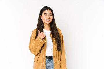 Young indian woman isolated on purple background smiling and raising thumb up