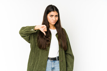 Young indian woman isolated on purple background showing thumb down, disappointment concept.
