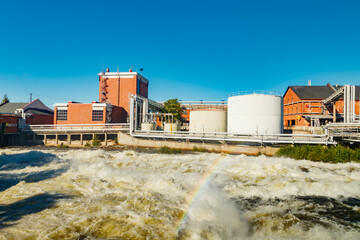 Kouvola, Finland - 15 September 2020: Old red brick buildings of Upm factory on rapids Kuusankoski...