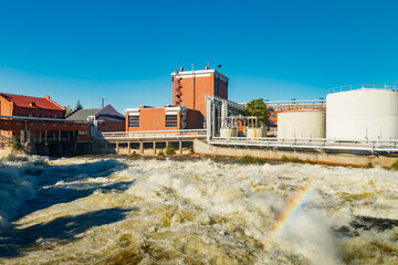 Kouvola, Finland - 15 September 2020: Old red brick buildings of Upm factory on rapids Kuusankoski...