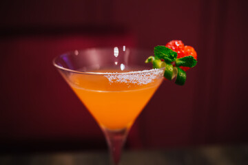 Glass of fresh cocktail on table