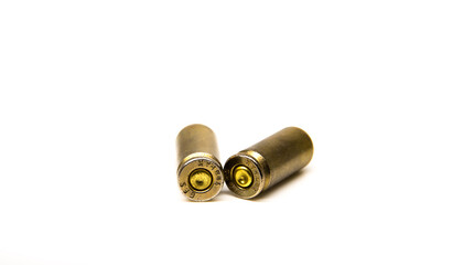 Two lying 9mm bullet sleeve on isolated background