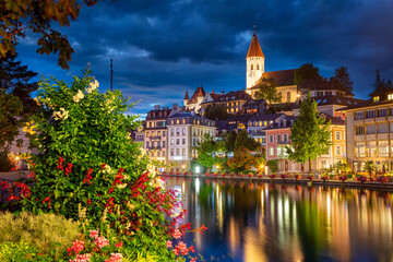 Thun, Switzerland. Cityscape image of beautiful city of Thun with the reflection of the city in the...