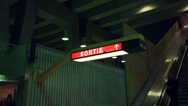 People Walking Down The Moving Escalators Inside The Underground Metro In Montreal During The Pandemic Coronavirus In Quebec, Canada. - panning shot