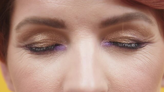 Portrait Of A Woman With Fine Lines Around Her Closed Eyes - Extreme Closeup Shot