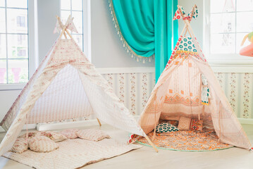 Children's wigwam in the nursery, home decor © Vladimir Muravin